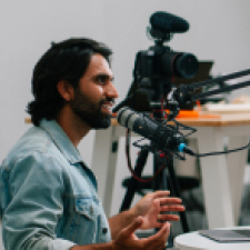 Man adding a new track to his podcast